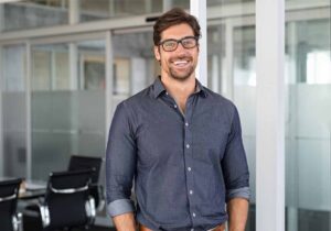 A law professional standing in his office