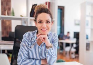 Female Solicitor sitting at her desk in an office setting