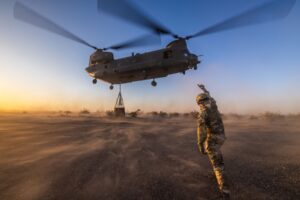 Leaving the military what education options blog image - soldier signalling military aircraft