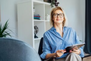switching careers to psychology blog female psychologist sitting facing camera