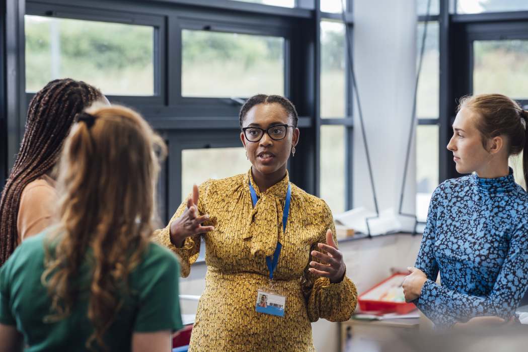 An educator using her knowledge from her principles of teaching and learning to engage her audience