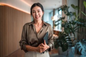 professional woman standing facing camera in her workplace career change at 40