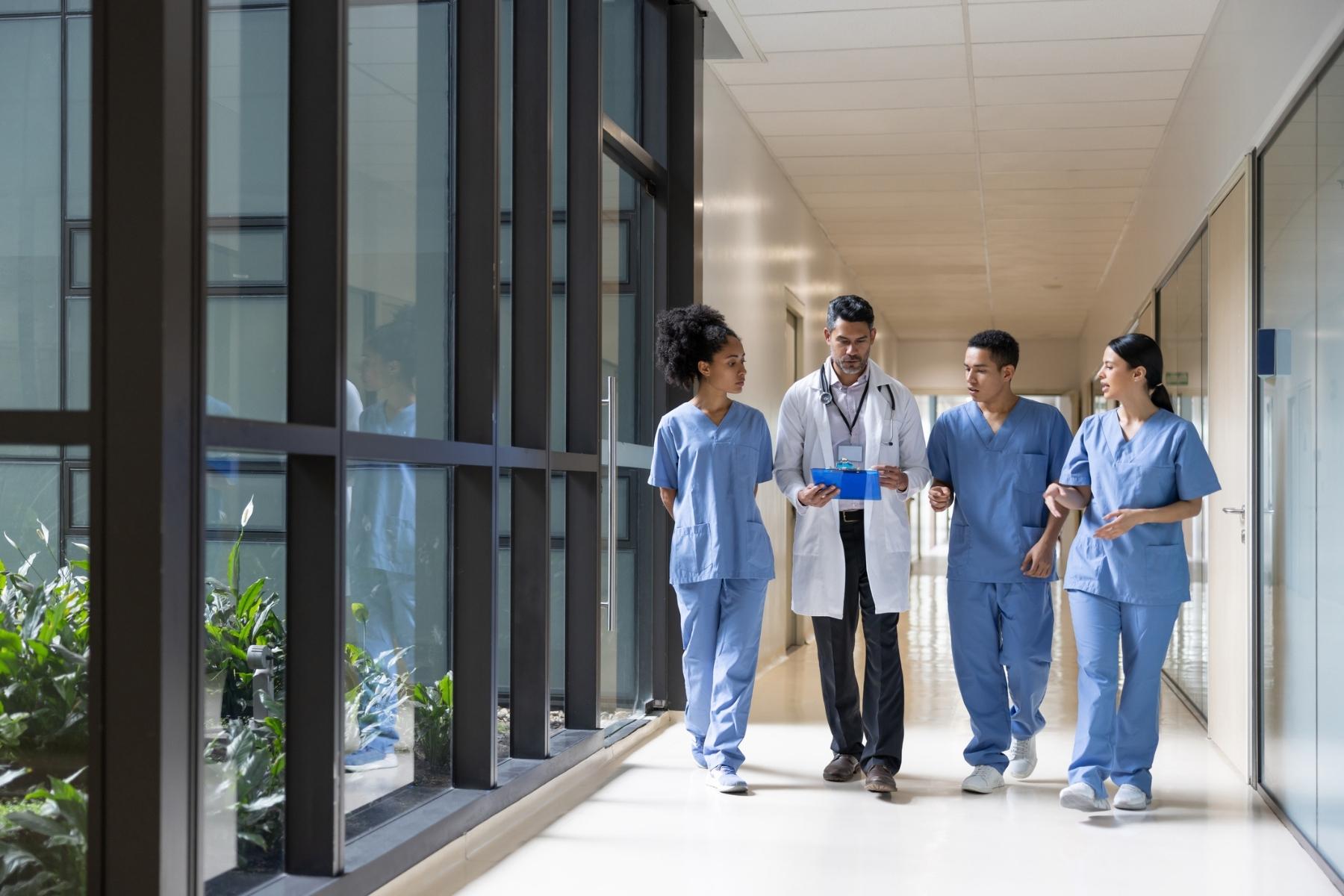 Woman holding laptop in office