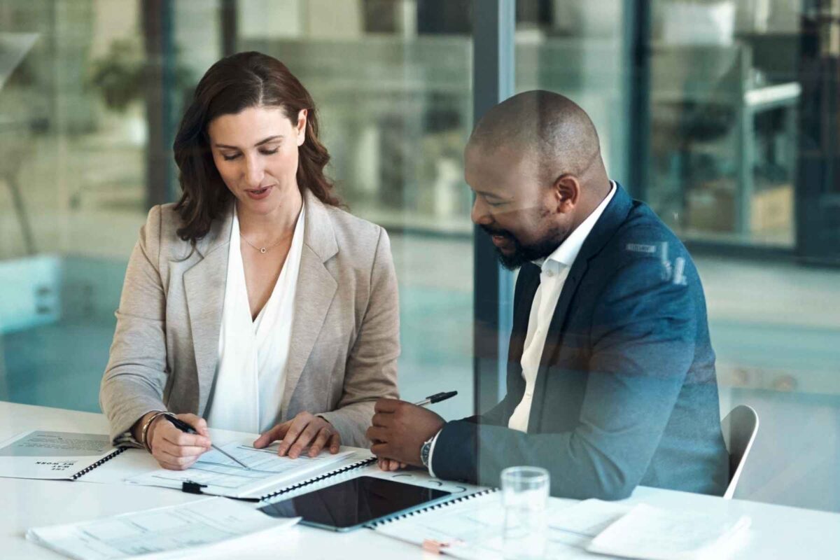 what can I do with a law degree? Two solicitors looking over a document.
