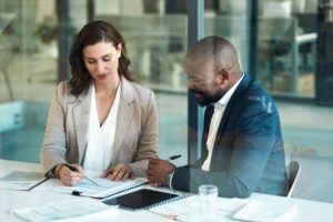 what can I do with a law degree? Two solicitors looking over a document.