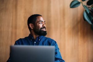 jobs for ex teachers blog image of man sitting in front of his laptop