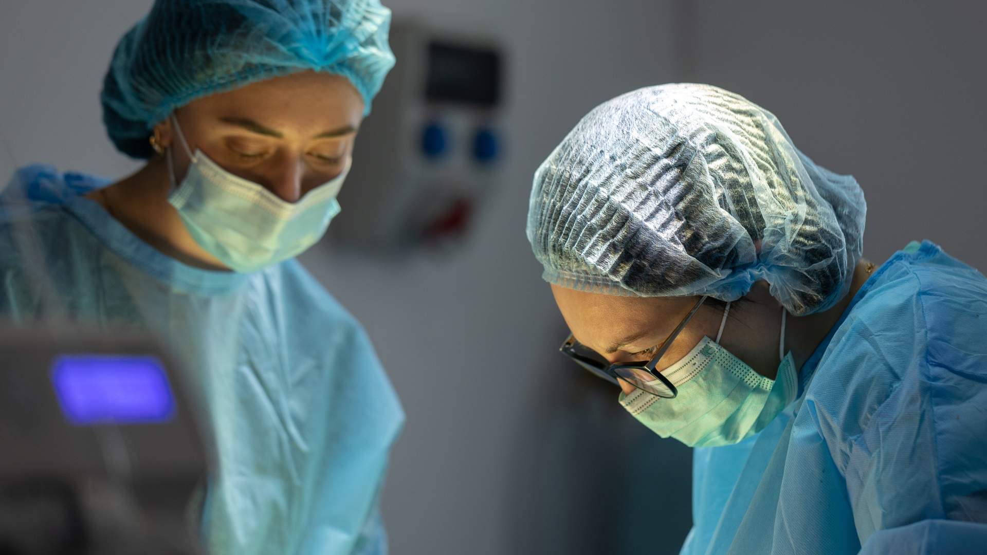 An oncoplastic breast surgeon is at work in an operating theatre